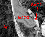 TEM image shows that SnO2 nucleates on In2O3 needles during internal oxidation of Ag-Sn-In alloys